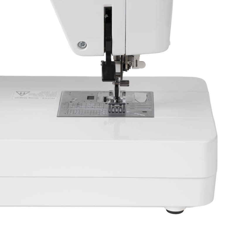 Janome Continental M6 sewing and quilting machine, white body with metal needle plate and presser foot.