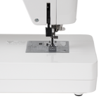 Janome Continental M6 sewing and quilting machine, white body with metal needle plate and presser foot.