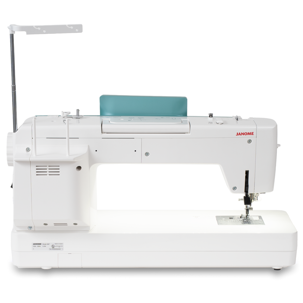 Janome Continental M6 sewing & quilting machine; white body with teal accessory panel and red JANOME logo.