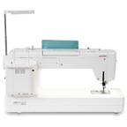Janome Continental M6 sewing & quilting machine; white body with teal accessory panel and red JANOME logo.