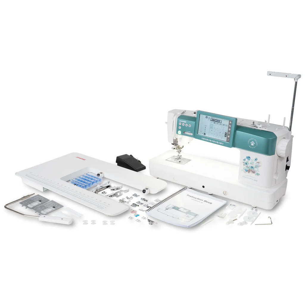 Janome Continental M6 sewing machine in turquoise with accessories and instruction book