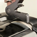 Skiving machine component in black metal with 50mm marking, close-up of clamp area on table
