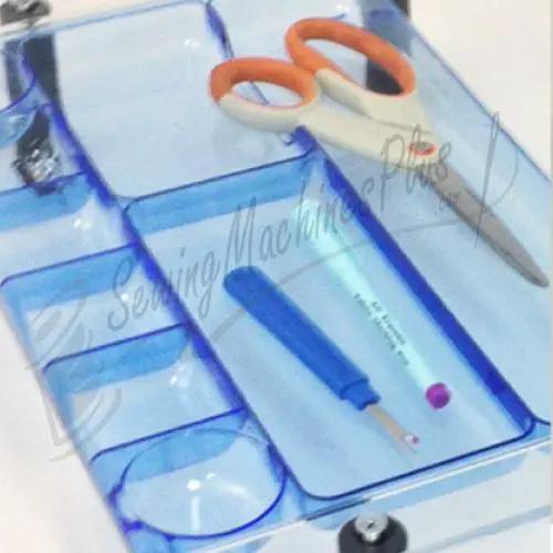Sew Steady Sewers Wish Table extension table with blue translucent case, orange-handled scissors, and blue marker.