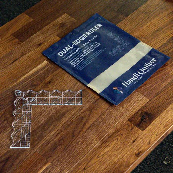 Handi Quilter Dual Edge Ruler, clear acrylic quilting ruler, with blue packaging (2 items).