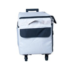 Tutto 21-inch EZ-Glide Trolley machine bag, gray with navy front pocket, on wheels.