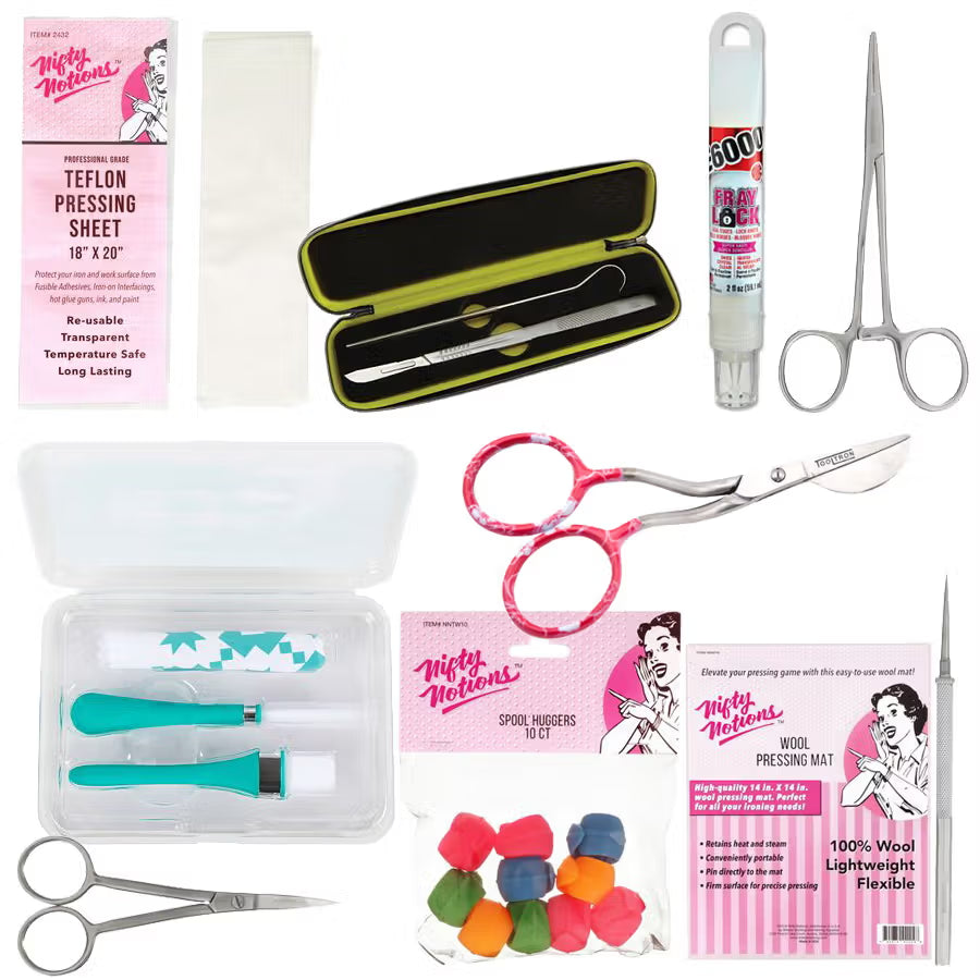 Collection of sewing and crafting tools including scissors, adhesives and sheets