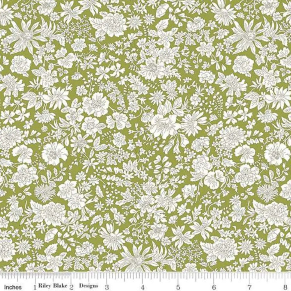 Liberty Fabrics Emily Belle Caterpillar 01666440A cotton quilting fabric featuring white botanical flowers on a fresh green background.
