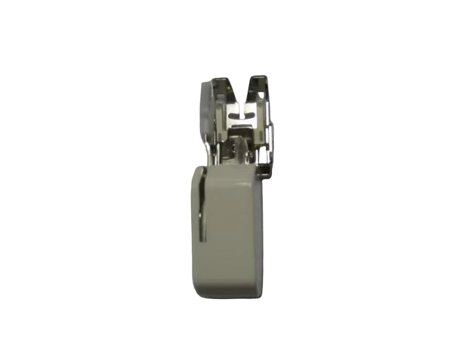 Sewing machine presser foot on a gray background