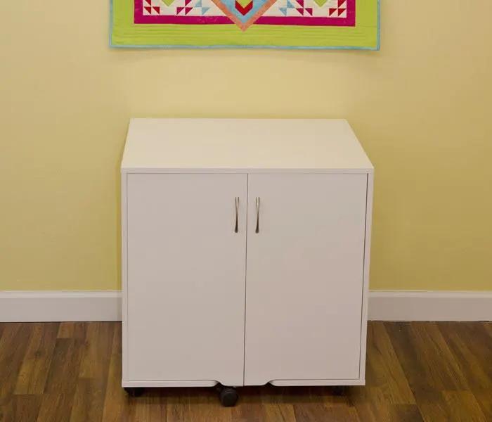 Arrow Mod Thread Cabinet white, two-door cabinet on wheels with chrome handles.