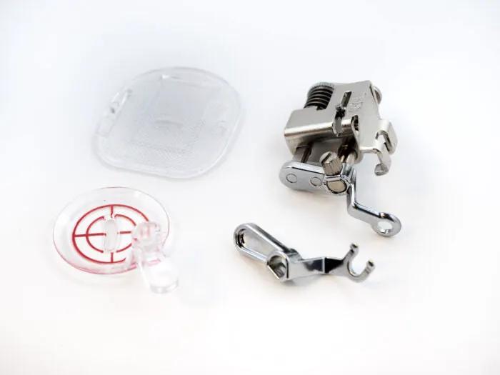 Presser feet set by Handi Quilter for free-motion quilting; includes four metal feet and a clear plastic case.