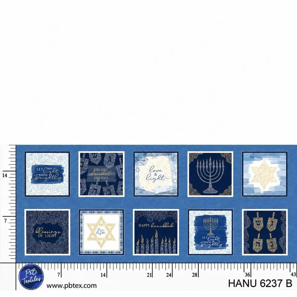 Hanukkah Lights Blue Blocks quilting cotton fabric with repeating 7-inch Hanukkah typography, menorah, dreidel, and Star of David blocks.