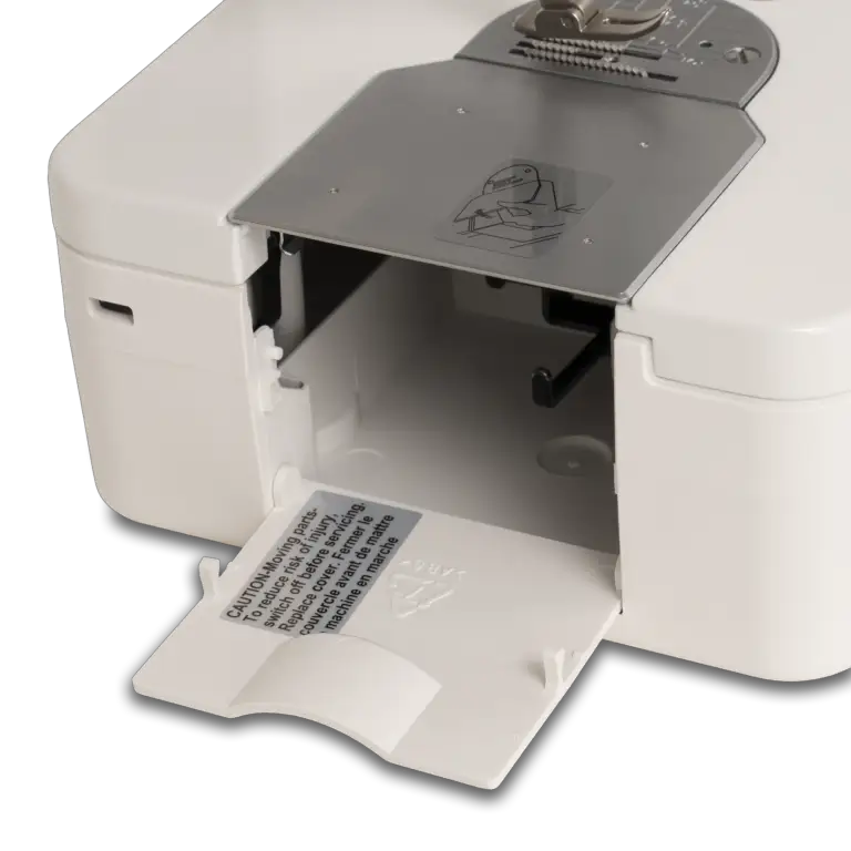 Janome HD9V3 heavy-duty sewing and quilting machine, white mechanical unit with open front panel.