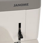 Janome HD9V3 heavy-duty sewing & quilting machine; gray lid with logo and white body, lever control visible