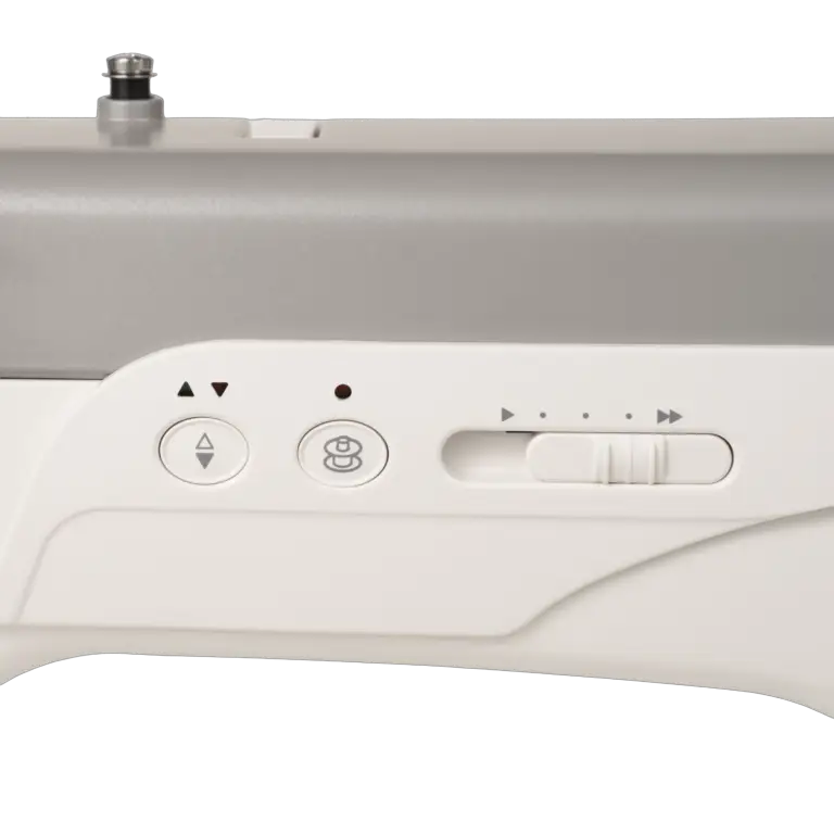 Janome HD9V3 white heavy-duty sewing machine control panel with arrow buttons and speed slider