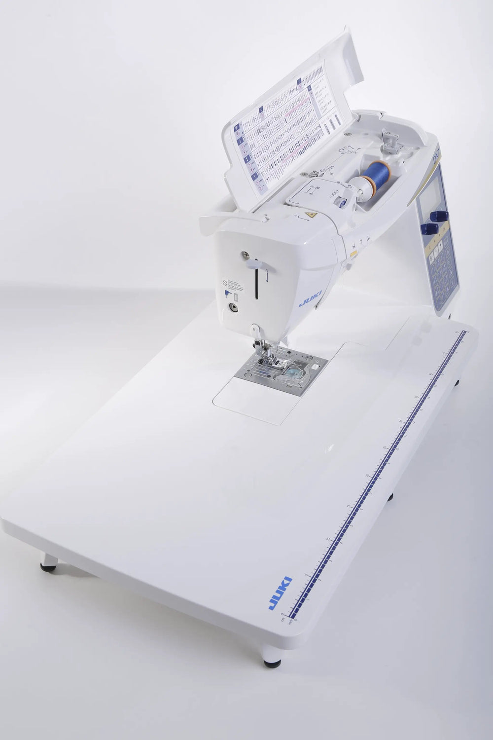 Juki HZL-DX7 computerized sewing machine in white with a large extension table.