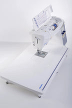 Juki HZL-DX7 computerized sewing machine in white with a large extension table.