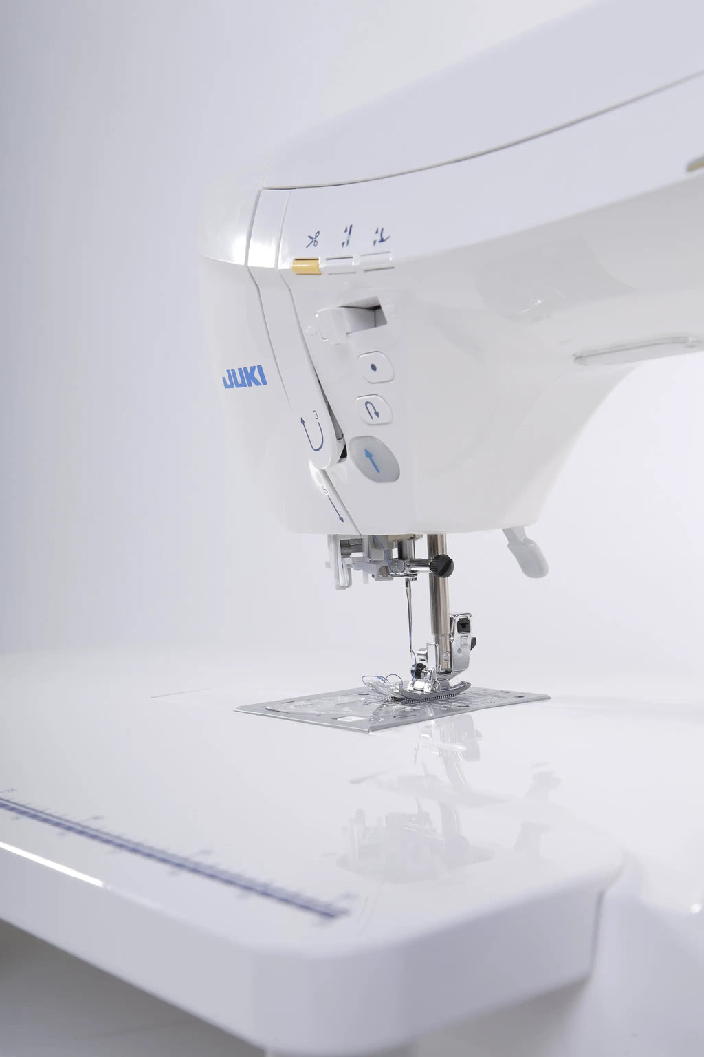 Juki HZL-DX7 computerized sewing machine in white, side view