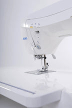 Juki HZL-DX7 computerized sewing machine in white, side view