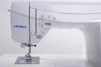 Juki HZL-DX7 sewing machine, white computerized model with blue JUKI logo and front control panel.