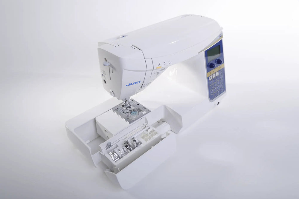 Juki HZL-DX7 white computerized sewing machine with blue control panel and LCD screen.