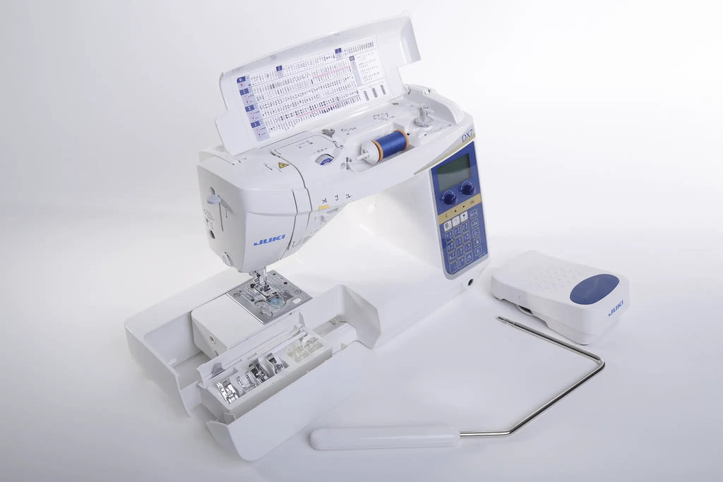 Juki HZL-DX7 computerized sewing machine with blue control panel and built-in threading chart.