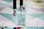 Handi Quilter HQ Quick Change Mount Square Feet Kit two presser feet; transparent square foot with metal fittings.