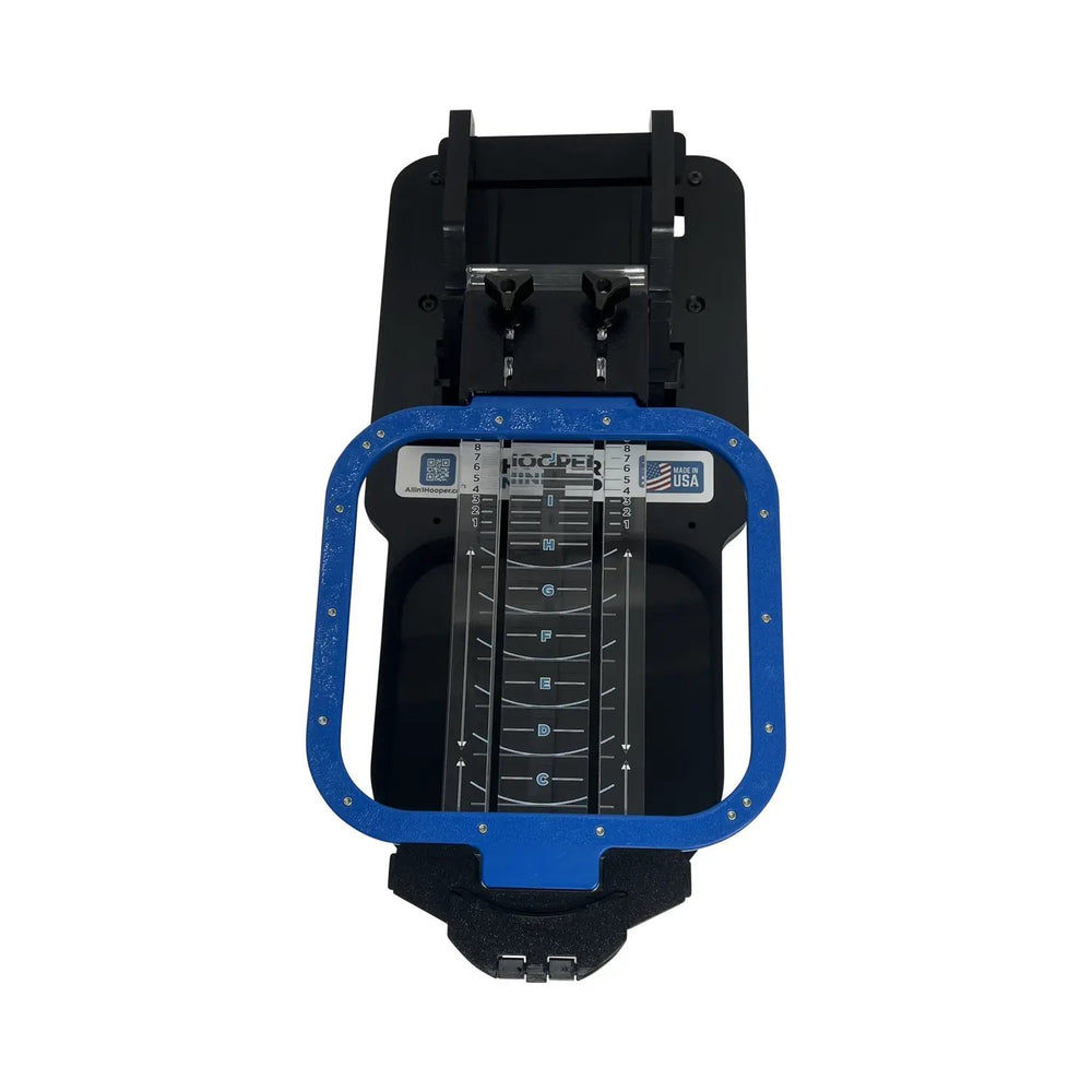 Hooper Mini with Combo Bracket System by Tex Inc; blue hoop frame on a black hooping station with vertical scale.