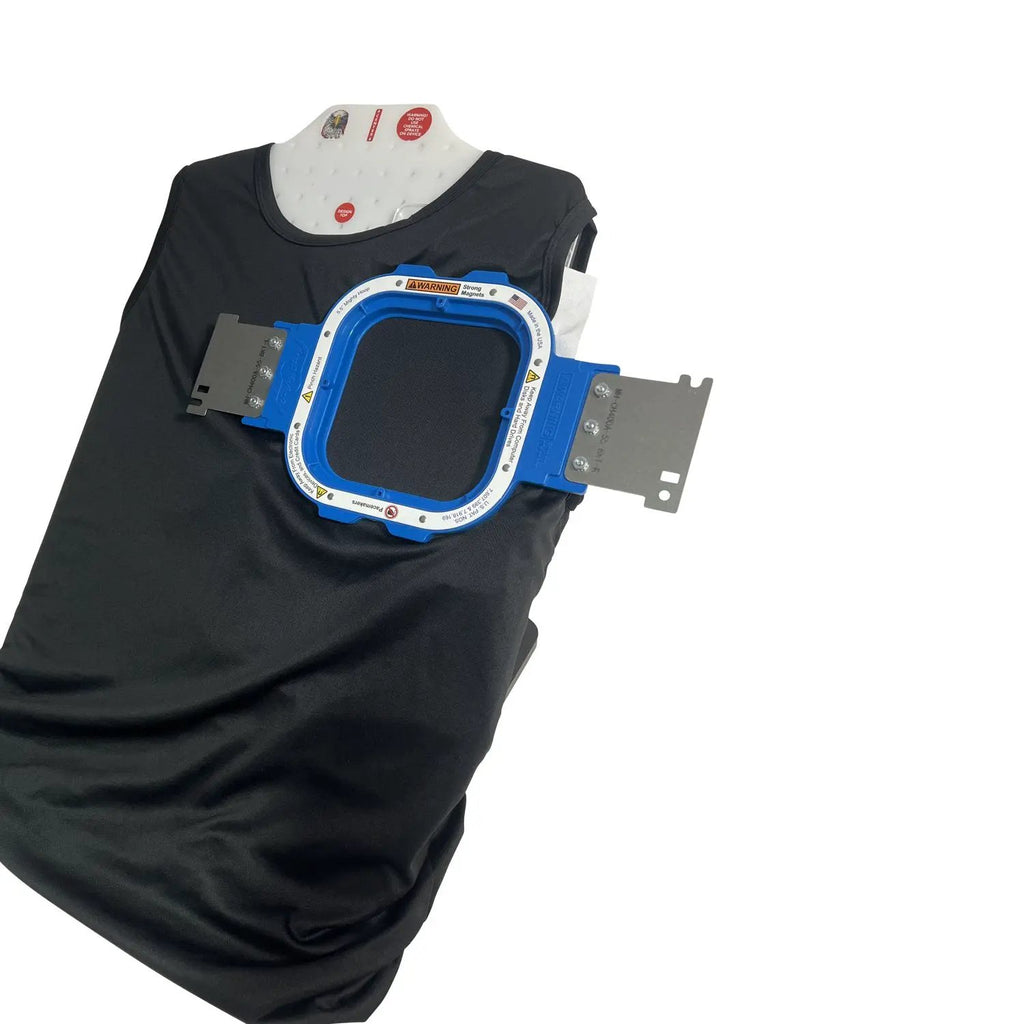Hooping station with blue Tex Inc Hooper One + Leveler Pro Plus embroidery hoops on a black shirt.