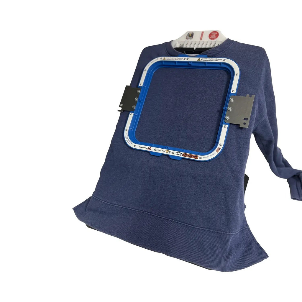 Hooping station Tex Inc Hooper One + Leveler Pro Plus embroidery hoop brackets on navy sweatshirt