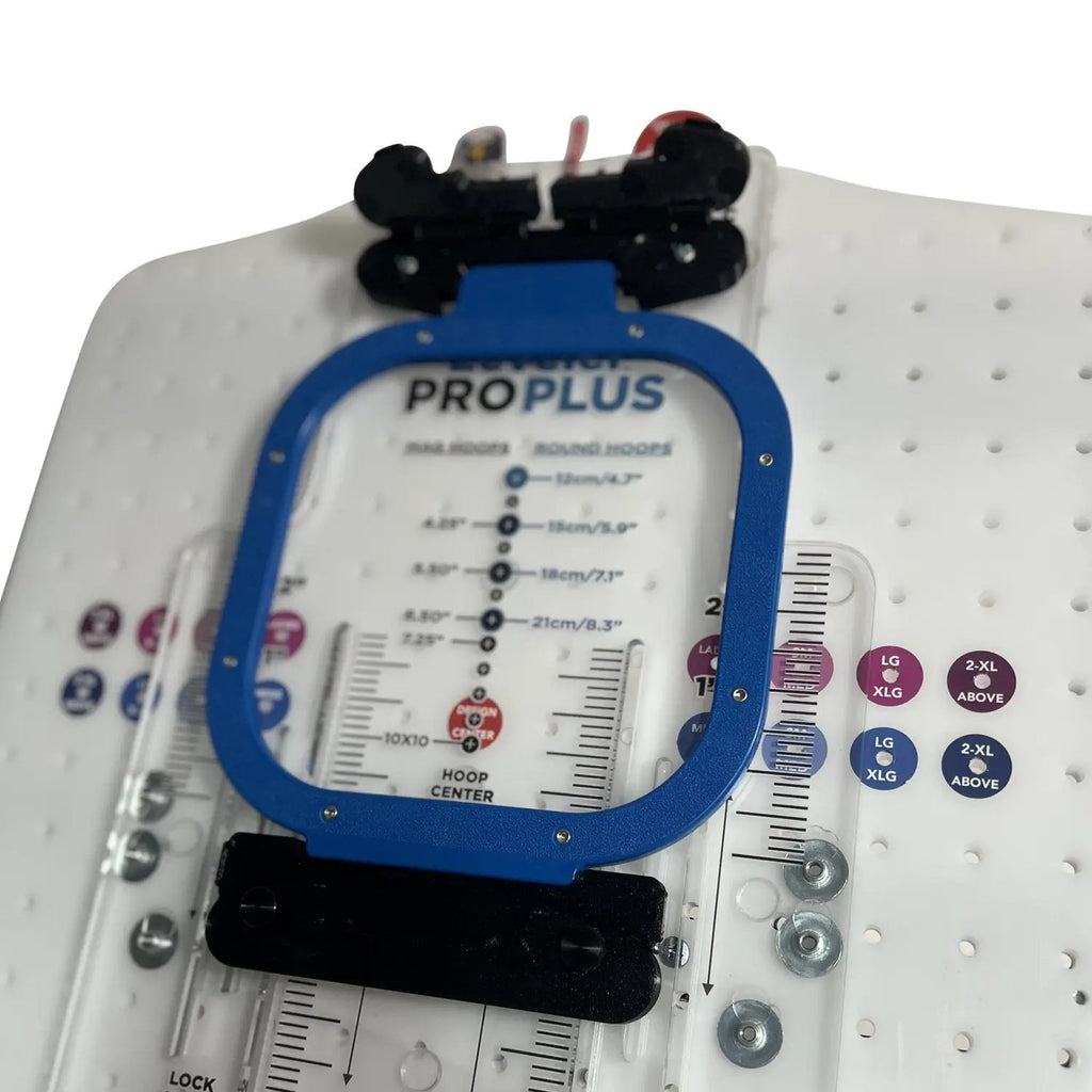 Hooping station with blue Hooper One + Leveler Pro Plus hoop frame and Mighty & Standard bracket system