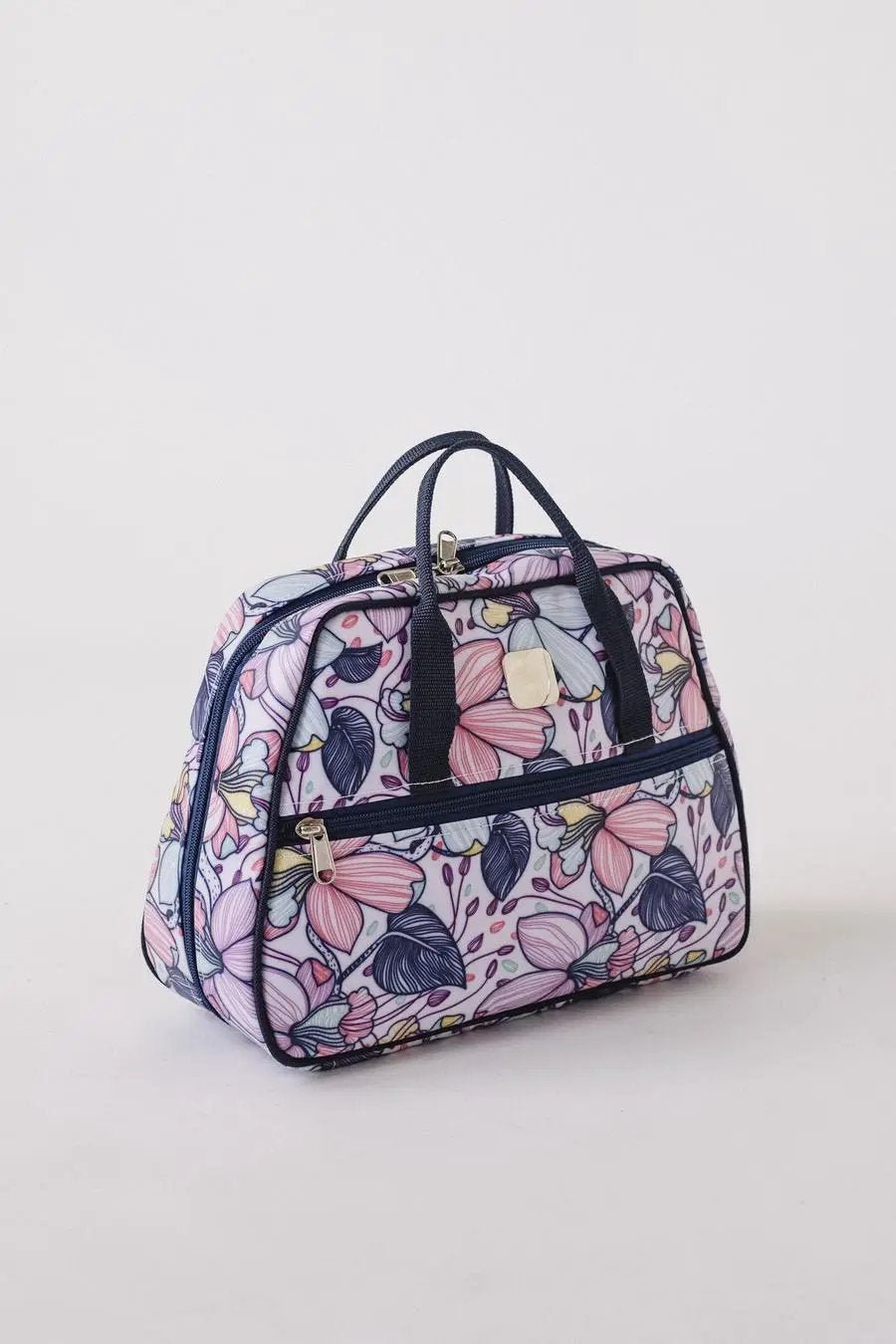 Bluefig Quilter Deluxe Maisy machine bag in floral print with navy trim and dual handles.
