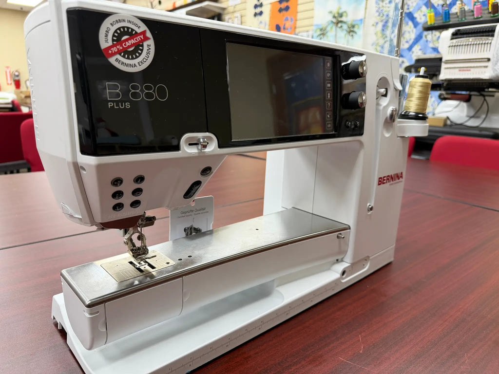 Bernina 880 Plus computerized sewing and embroidery machine in white with touchscreen display