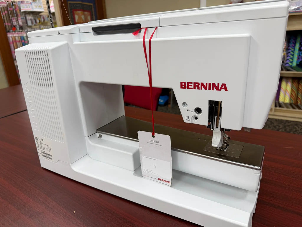 Bernina 880 Plus computerized sewing & embroidery machine, white with red BERNINA logo