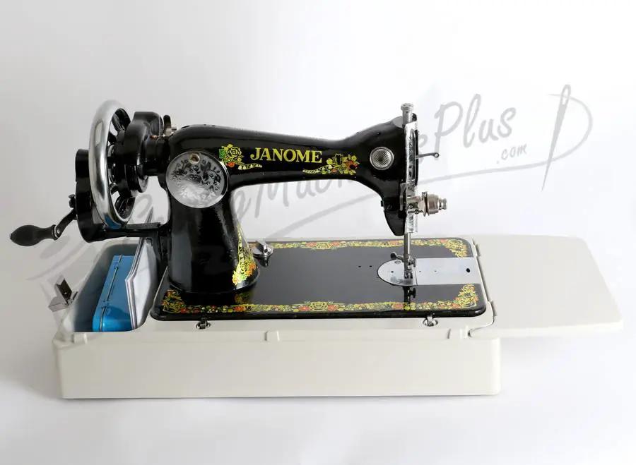 Janome 131HDL hand-crank sewing machine with black body and floral decals on white base
