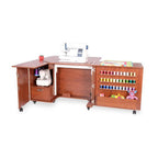 Kangaroo Wallaby II Studio sewing cabinet in teak with white sewing machine and thread spool rack