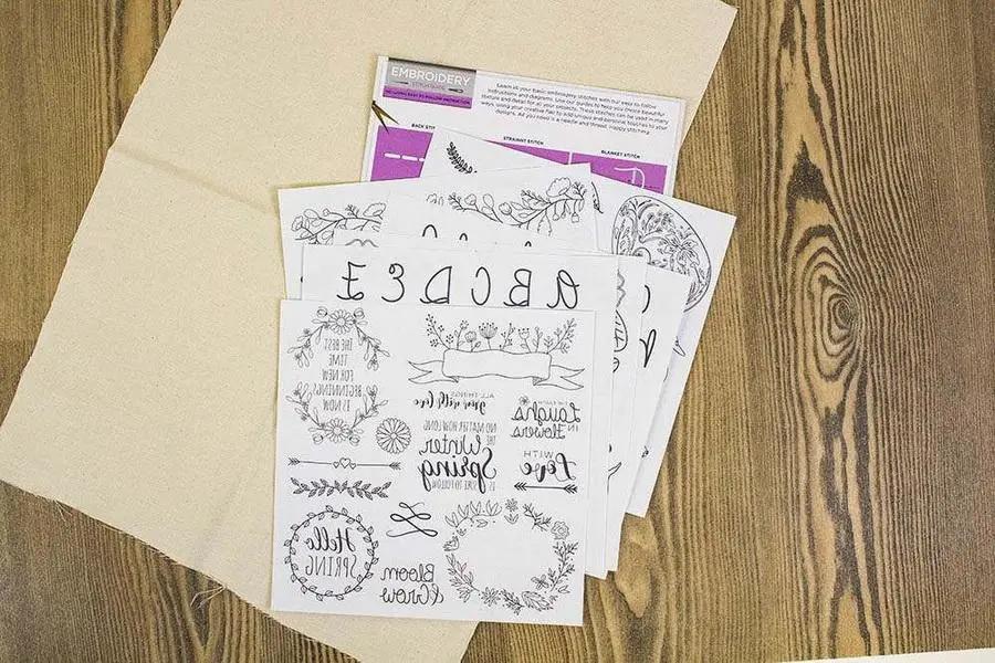Threaders embroidery transfer sheets - Spring, set of 5 white sheets with black designs.