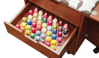 Inspira Inspiration Caddy sewing cabinet in teak with an open drawer filled with colorful thread spools
