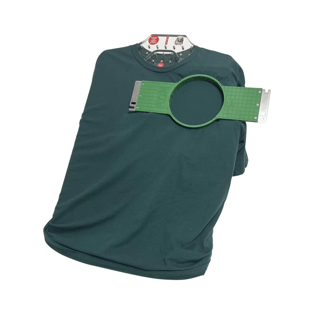 All in 1 Leveler Pro hooping station by Tex Inc; green circular leveler on a teal shirt display