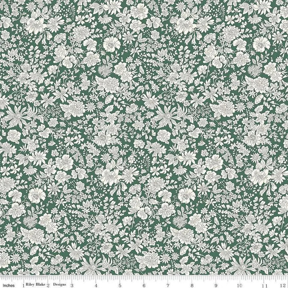 Liberty Fabrics Emily Belle Evergreen 01666445A cotton quilting fabric featuring delicate tonal botanical flowers on an evergreen green background.