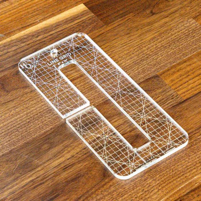 Handi Quilter Line Grid 6x.5in quilting ruler; clear acrylic with grid lines and a U-shaped slot