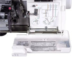 Janome MyLock 654D serger, white with front threading diagram and exposed interior components.
