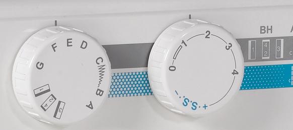 Janome MyStyle 100 sewing machine control dials and stitch selector.