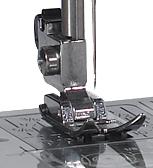 Janome MyStyle 100 sewing machine close-up of presser foot and needle plate, built-in stitches