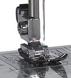 Janome MyStyle 100 sewing machine close-up of presser foot and needle plate, built-in stitches