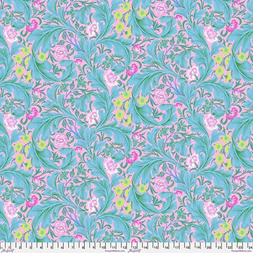 Leicester Aqua quilting cotton fabric featuring turquoise foliage and colorful floral motifs on a soft pink background.