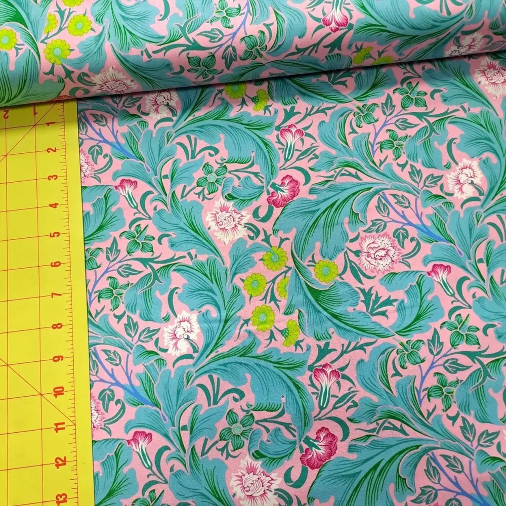 Leicester Aqua quilting cotton fabric showing aqua foliage and colorful floral motifs with ruler for scale.