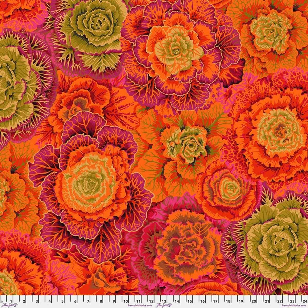 Brassica Rust quilting cotton fabric with oversized botanical leaves in rust, orange, burgundy, green, and pink tones.