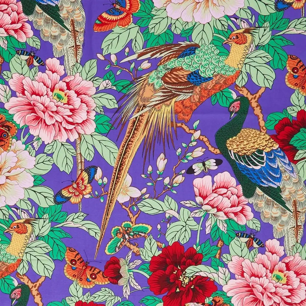 Birds and Bees Purple quilting cotton fabric by Philip Jacobs featuring colorful birds, flowers, butterflies, and garden motifs on a purple background.