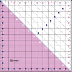 Threaders 12.5-inch square folding ruler; pink with grid lines and diagonal guide marks, Threaders logo visible.