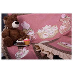 Anita Goodesign Baby Tea Party embroidery design software, pink tea party scene with a teddy bear and cupcakes